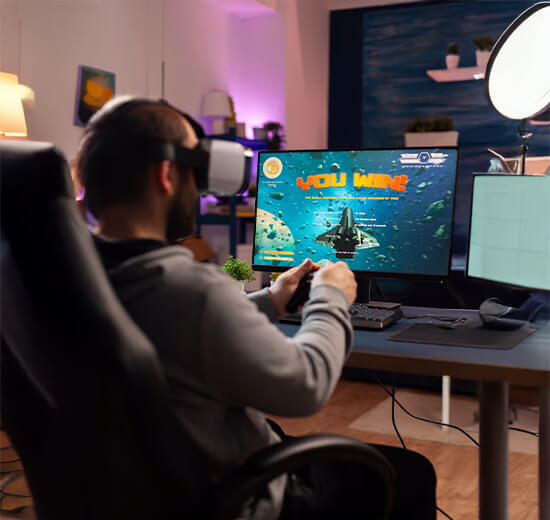 Boy playing game on computer
