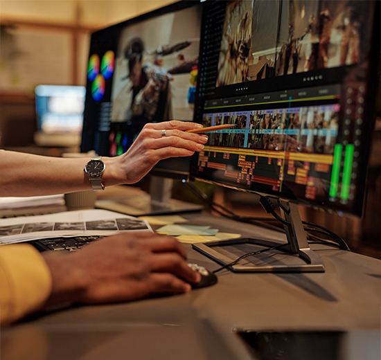 Person editing a video timeline on a computer screen