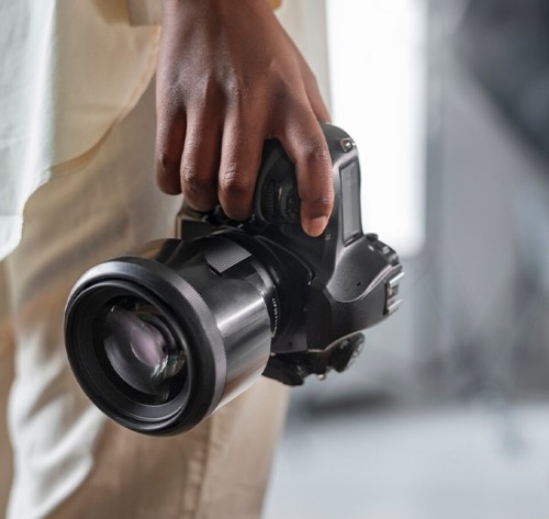 Photographer with camera in hand